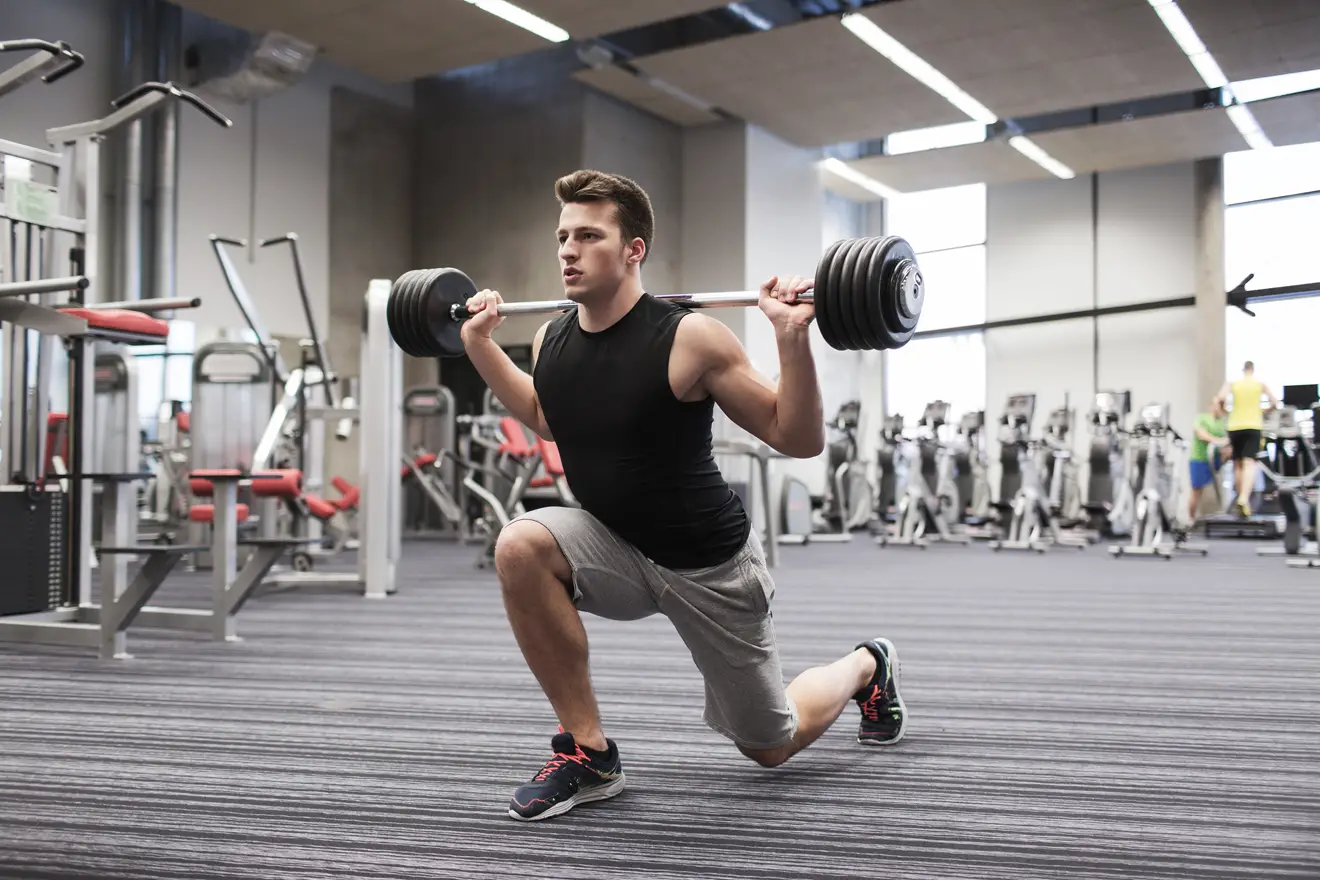 Man doing barbell lunge
