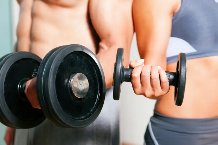 Man and woman holding a dumbbell