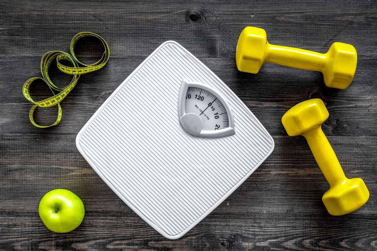 Dumbbells and scales on a table