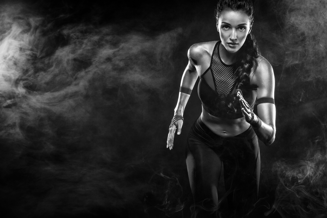 Athletic woman sprinting