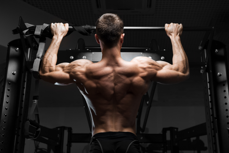 Man doing pull-up exercise on pull-up bar