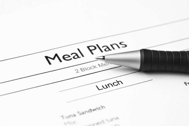 printed meal plan and pen