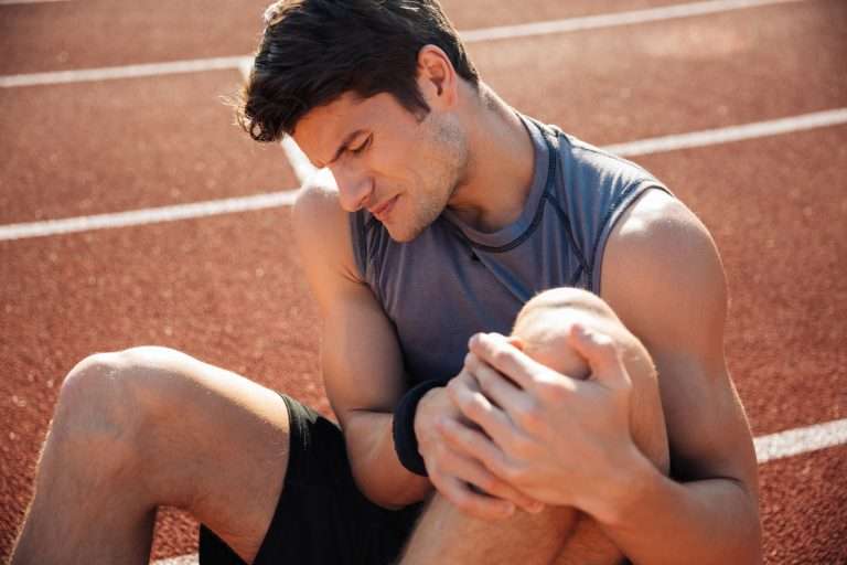 man experiencing lactic acid build-up while exercising