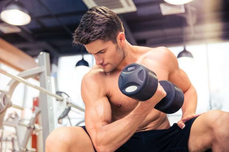 man performing a bicep curl with one arm